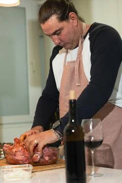 Man preparing meat for cooking with red wine 스톡 사진