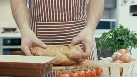 Man preparing meat in the kitchen . Stock Footage 85787700