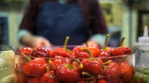 A Man Preparing Mix Pickled Bell Peppers in a Pickle Shop in Istanbul Stock Footage 126728910
