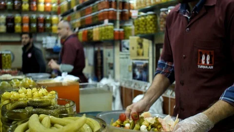 A Man Preparing Mix Pickled Vegetables in a Pickle Shop in Istanbul Video stock 126729352