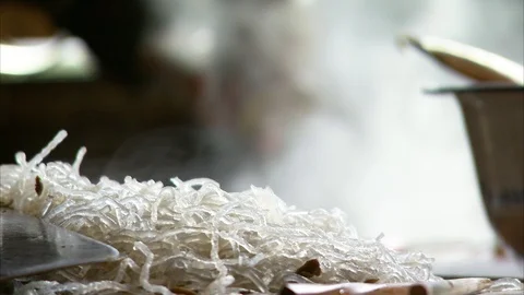 Man preparing noodle soup in the kitchen Stock Footage 88825801