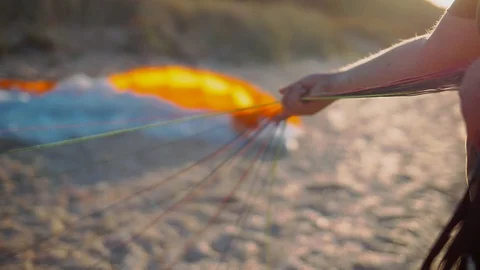 Man preparing a parachute slings for a flight Stock Footage 89367958