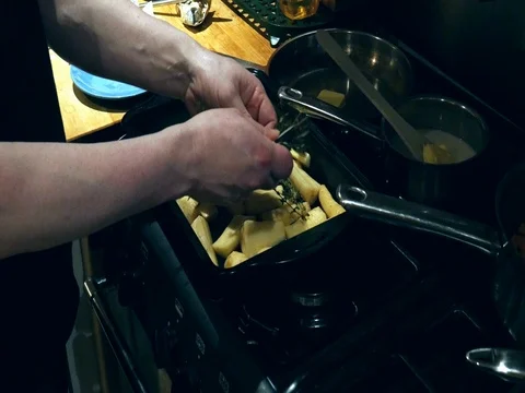 Man preparing parsnips for cooking. Video stock 84187146