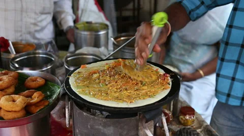 Man preparing pizza on a chapati. Stock Footage 49265798