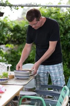 Man preparing plates Stock Photos