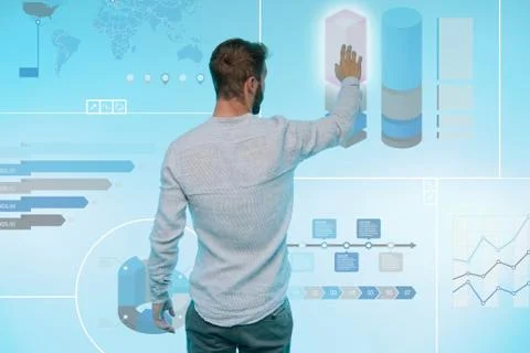 Man preparing presentation on graphical screen, rear view Stock Photos