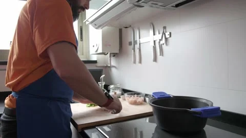 Man preparing a recipe with a computer Stock-Footage 136410382