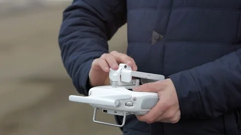Man preparing remote controller to flight. Stock Footage 69960772
