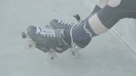 Man Preparing For Roller Skating, Putting On Rollerskates 動画素材 105261764