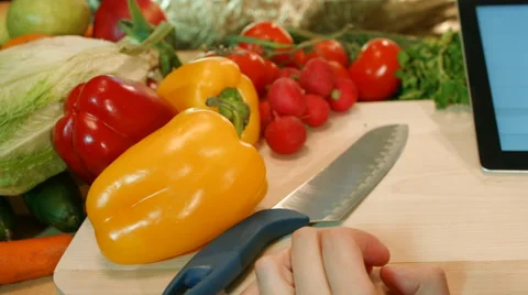 Man preparing salad vegetable dish and writes a prescription for a tablet comput Stock Footage 62837858
