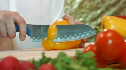 Man preparing salad from vegetables chopped pepper. Stock Footage 62842401