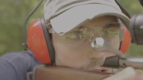 Man preparing to shoot a Rifle at a range Stock-Footage 53643650