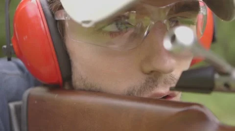 Man preparing to shoot a Shotgun at a range Stock-Footage 53643800