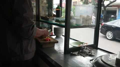 Man preparing soto to take away by customer Stock Footage 219403322