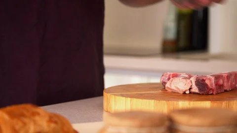 Man preparing steak in a kitchen Stock-Footage 130059446
