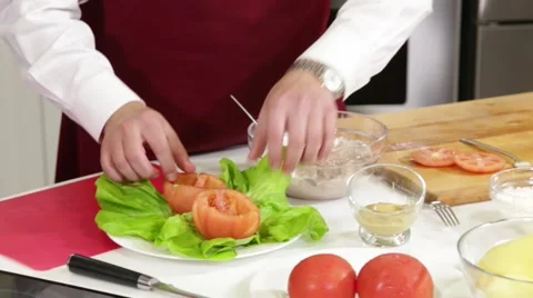 Man preparing stuffed tomatoes Stock Footage 45136704