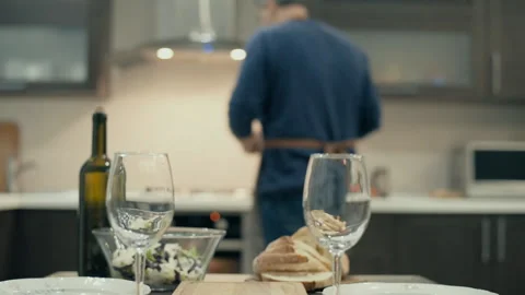 Man preparing supper for two persons. 動画素材 85793609