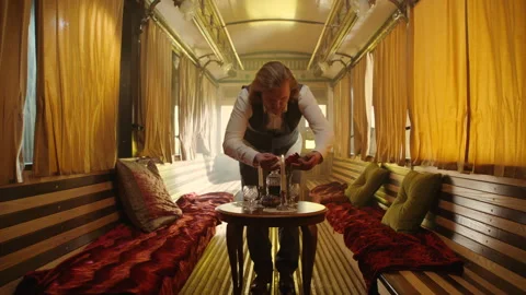 A man preparing the table for a date with wine glasses 스톡 동영상 259588153