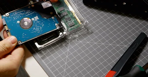 Man preparing to upgrade the computer with SSD and faster ram Video stock 69256914
