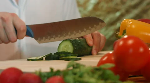 Man preparing vegetable salad sliced cucumber. Видео 62840328