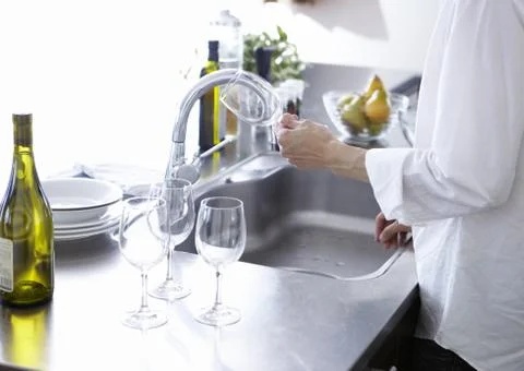 Man preparing wine glasses Stock Photos