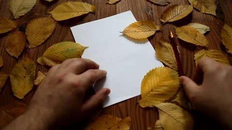 A man is preparing to write a letter.  Autumn mood. Stock Footage 140097219