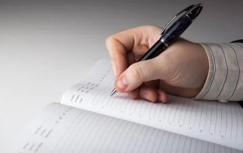 Man is preparing for written work Stock Photos