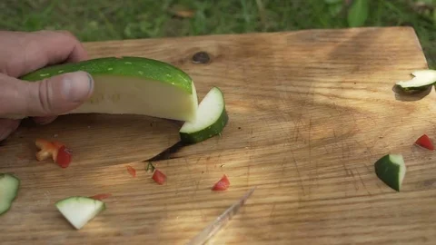 Man preparing zucchini in the open air hd Video stock 80240842