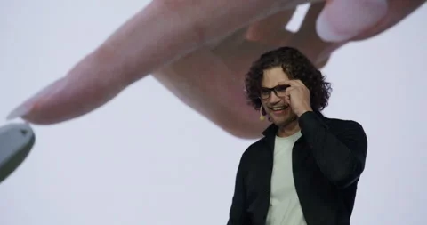 Man presenter entering the stage during AI artificial intelligence conference Stock Footage 244778259