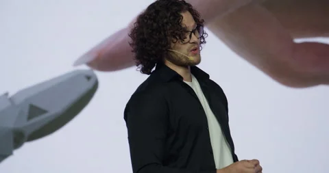 Man presenter entering the stage during AI artificial intelligence conference Stock Footage 244778458