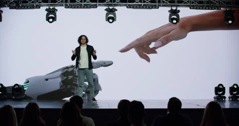 Man presenter entering the stage during AI artificial intelligence conference Stock Footage 244778675