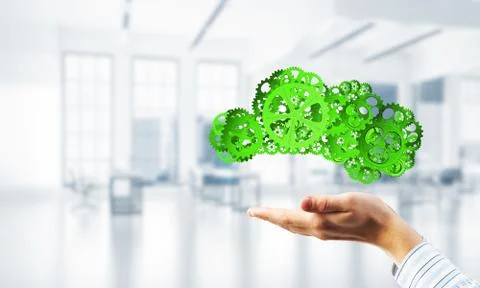 Man presenting in his palms cloud computing concept as mechanism of cogwheels 스톡 사진