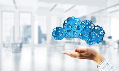 Man presenting in his palms cloud computing concept as mechanism of cogwheels 스톡 사진