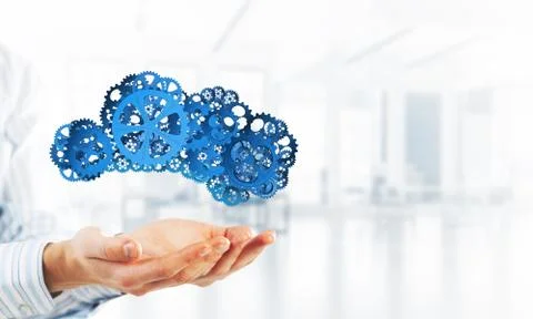 Man presenting in his palms cloud computing concept as mechanism of cogwheels 스톡 사진