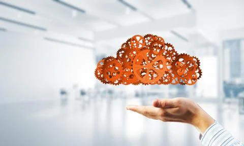 Man presenting in his palms cloud computing concept as mechanism of cogwheels 스톡 사진