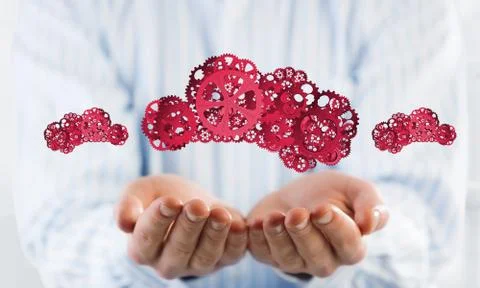 Man presenting in his palms cloud computing concept as mechanism of cogwheels Foto stock