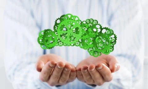 Man presenting in his palms cloud computing concept as mechanism of cogwheels Stock Photos