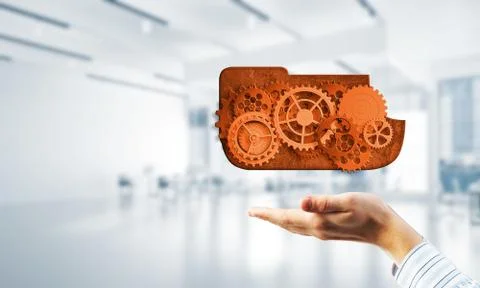 Man presenting in his palms cloud computing concept as mechanism of cogwheels Stock Photos
