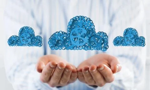 Man presenting in his palms cloud computing concept as mechanism of cogwheels Stockfoto's
