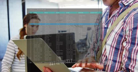 Man presenting laptop, typing in open-plan office, activating terminal overlay Stock Photos