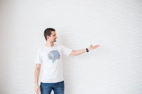Man presenting or showing something your text or product. Stock Photos