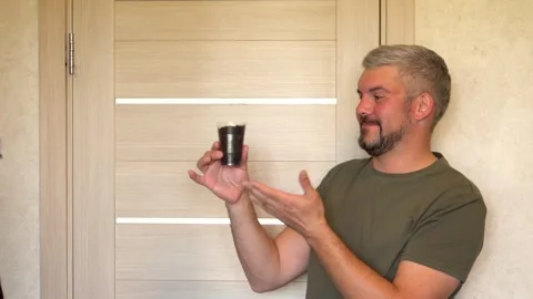 Man presenting a plant 4K Stock-Footage 274402588