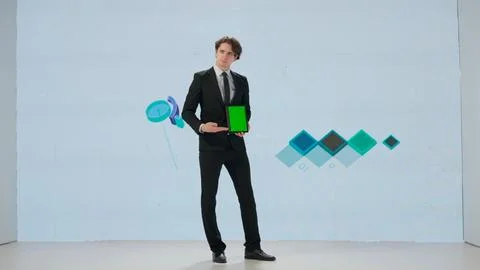 Man presenting project on stage during meeting. Ceo businessman speaker with Foto stock
