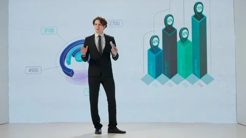 Man presenting project on stage during meeting. A businessman talks to the Foto stock
