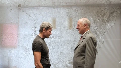 Man presenting rolled documents/building plans to a businessman and then shaking 스톡 동영상 88438235