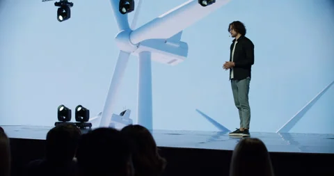 Man presenting on the stage during ecological renewable energy conference Stock Footage 244781771