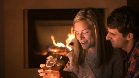 Man presenting a surprise gift box to a woman Stock Footage 60253889