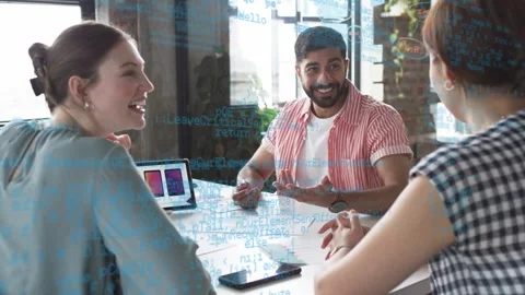 Man presenting tablet and leading design meeting reviewing mockups, blue code Stock Footage 333078344