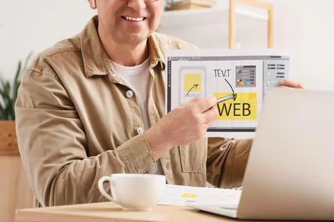 Man presenting web design layout with stylus pen, user interface development  Stock Photos