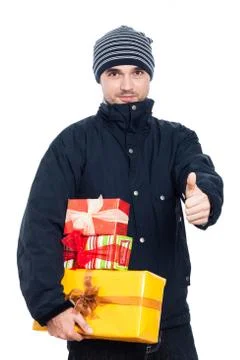 Man with presents thumbs up Stock Photos